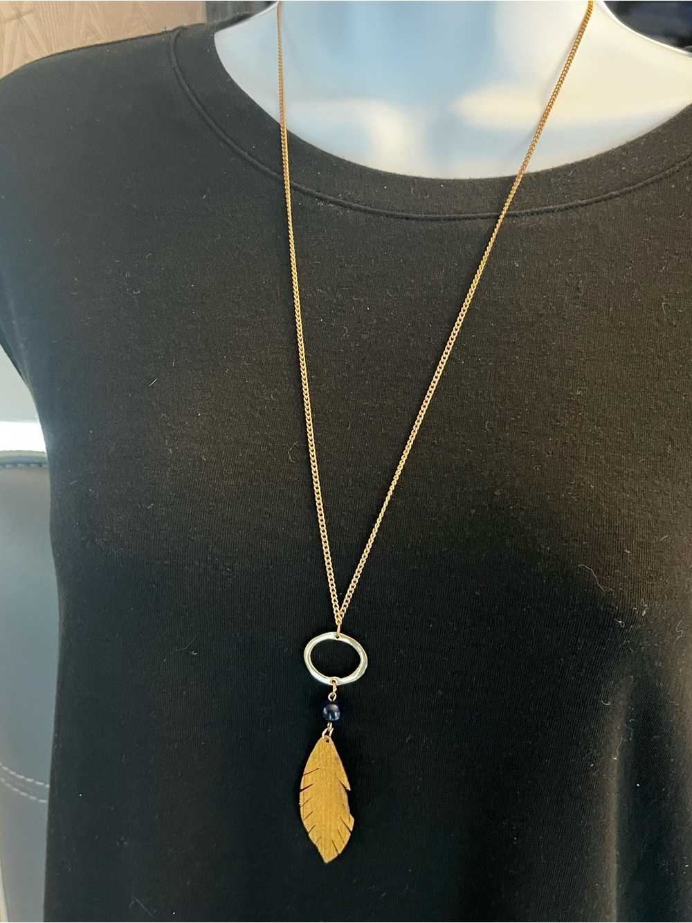Gold Tone Leather Feather Pendant Necklace with Blue Accent